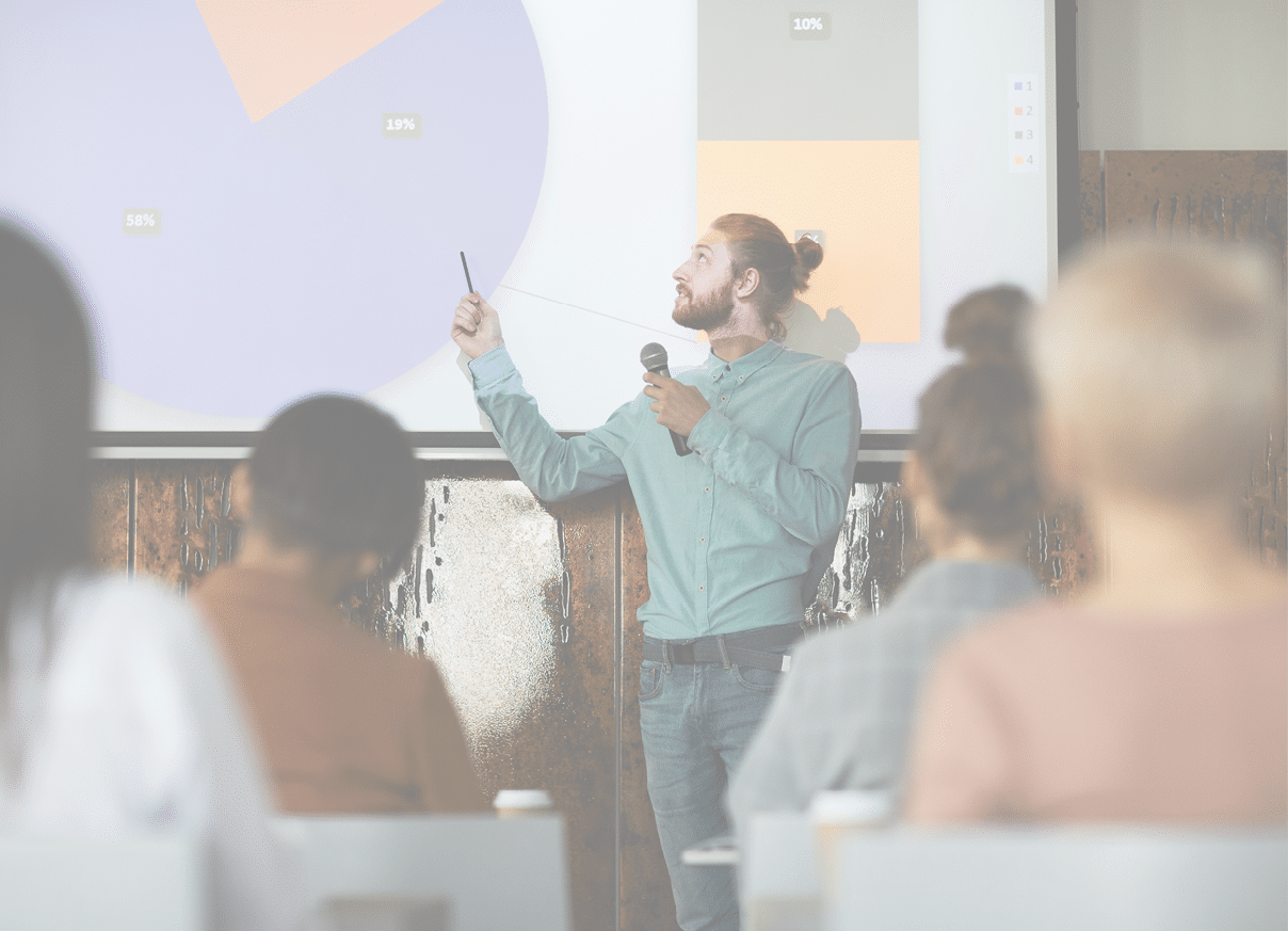 Portrait of contemporary bearded man giving presentation standing by projector screen in lecture hall, copy space